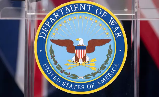 The seal is seen on a podium at the Pentagon, Wednesday, Dec. 10, 2025, in Washington, before Defense Secretary Pete Hegseth speaks. (AP Photo/Mark Schiefelbein)