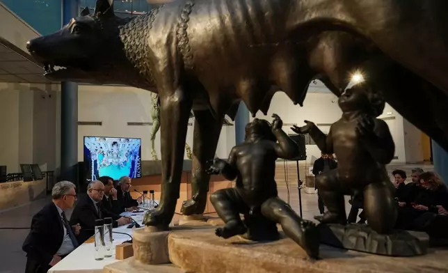 Rome's Mayor Roberto Gualtieri, second from left, announces at a press conference that starting on Feb. 1, it will impose a 2 euro fee for tourists to get close to the Trevi Fountain, in Rome, Friday, Dec. 19, 2025, . (AP Photo/Andrew Medichini)