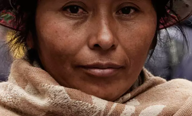 A miner marches during a protest President Rodrigo Paz's decision to remove fuel subsidies in La Paz, Bolivia Monday, Dec. 22, 2025. (AP Photo/Freddy Barragan)