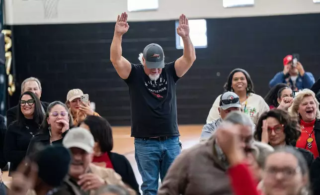 People celebrate after passage of the National Defense Authorization Act by the U.S. Senate during a watch party hosted by the Lumbee Tribe of North Carolina, Wednesday, Dec. 17, 2025, in Pembroke, N.C. (AP Photo/Allison Joyce)