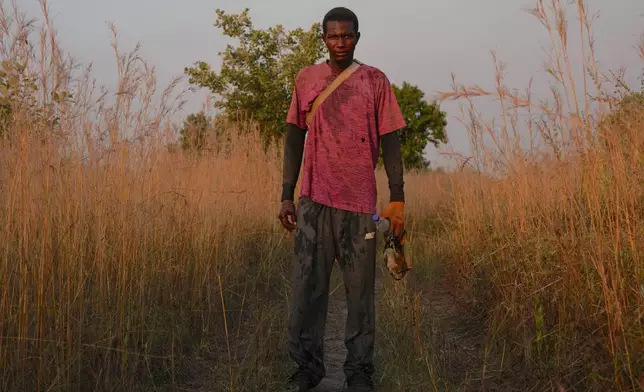 Filly Mangassa, who is part of a growing trend of young Africans moving to rural areas for better work opportunities, stands in a field in Tambacounda, Senegal, Wednesday, Nov. 5, 2025. (AP Photo/Mark Banchereau)