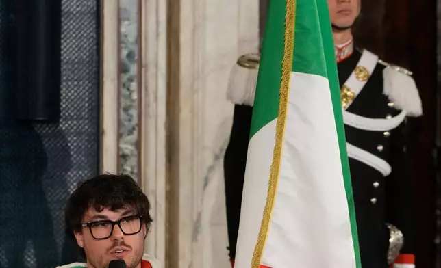 Italian Paralympic athlete Rene' de Silvestro delivers his speech during the hand over ceremony of the Italian flag by the Italian President Sergio Mattarella for the Milan-Cortina Winter Olympic games, at the Quirinale Presidential palace, in Rome, Monday, Dec. 22, 2025. (AP Photo/Gregorio Borgia)