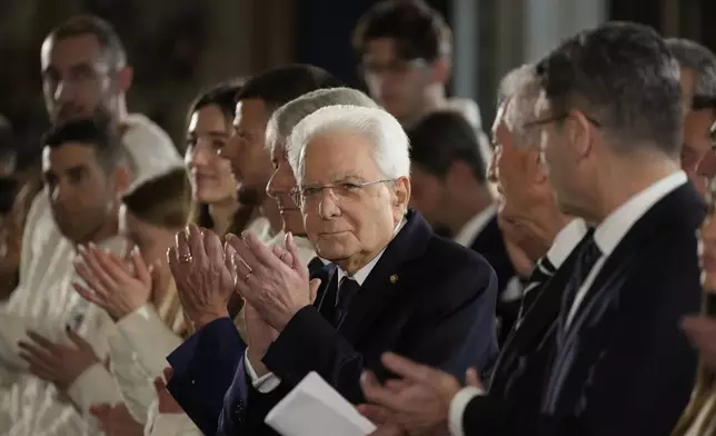 Italian by the Italian President Sergio Mattarella applauds during the hand over ceremony of the Italian flag for the Milan-Cortina Winter Olympic games, at the Quirinale Presidential palace, in Rome, Monday, Dec. 22, 2025. (AP Photo/Gregorio Borgia)