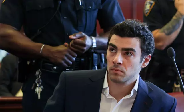 Luigi Mangione appears in Manhattan Criminal Court for an evidence hearing, Thursday , Dec. 18, 2025, in New York. (Shannon Stapleton/Pool Photo via AP)