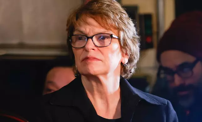 Brown University President Christina H. Paxson attends a news conference addressing the investigation following a shooting on Brown University's campus Saturday, Dec. 13, 2025, in Providence, R.I. (Lily Speredelozzi/The Sun Chronicle via AP)