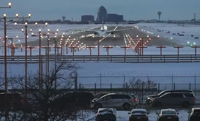 FILE - An American Airlines plane arrives at the O'Hare International Airport in Chicago, Sunday, Nov. 30, 2025. (AP Photo/Nam Y. Huh, File)