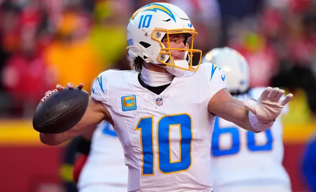 Los Angeles Chargers quarterback Justin Herbert throws during the second half of an NFL football game against the Kansas City Chiefs Sunday, Dec. 14, 2025, in Kansas City, Mo. (AP Photo/Charlie Riedel)