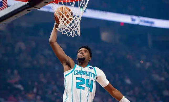 Charlotte Hornets' Brandon Miller (24) prepares to dunk against the Cleveland Cavaliers during the first half of an NBA basketball game, in Cleveland, Sunday, Dec. 14, 2025. (AP Photo/Phil Long)