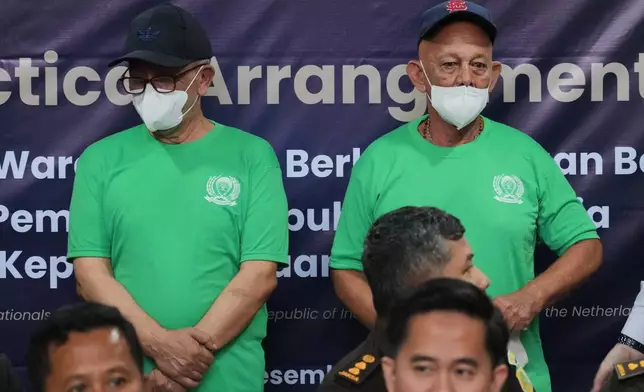 Dutch nationals facing death row Siegfried Mets, right, and serving life in prison, Ali Tokman, left, attend the handover ceremony between the representatives of Indonesian and Dutch government before their repatriation to the Netherlands, at Cipinang Prison in Jakarta, Indonesia, Monday, Dec. 8, 2025. (AP Photo/Tatan Syuflana)