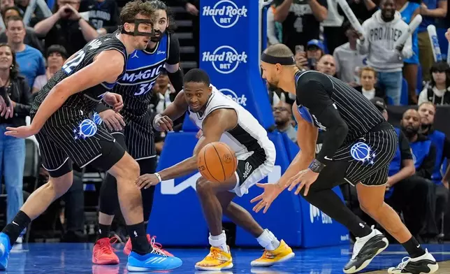 during the second half of an NBA basketball game, Wednesday, Dec. 3, 2025, in Orlando, Fla. (AP Photo/John Raoux)