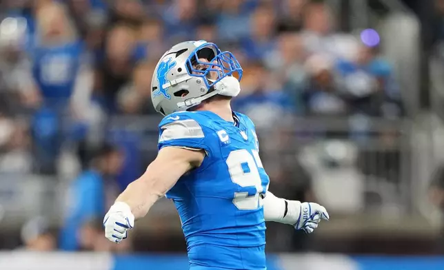 Detroit Lions' Aidan Hutchinson reacts after sacking Pittsburgh Steelers' Aaron Rodgers during the first half of an NFL football game, Sunday, Dec. 21, 2025, in Detroit. (AP Photo/Ryan Sun)