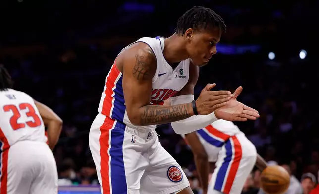 Detroit Pistons guard Marcus Sasser (25) reacts after a basket by Detroit Pistons guard Jaden Ivey (23) during the first half of an NBA basketball game Tuesday, Dec. 30, 2025, in Los Angeles. (AP Photo/Caroline Brehman)