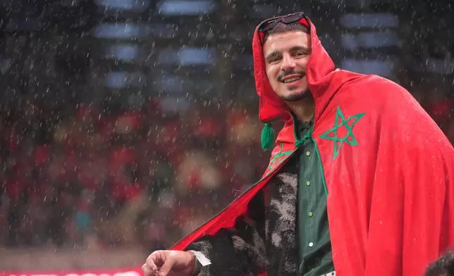A Morocco fan waits for the Africa Cup of Nations group A soccer match between Morocco and Comoros in Rabat, Morocco, Sunday, Dec. 21, 2025. (AP Photo/Mosa'ab Elshamy)