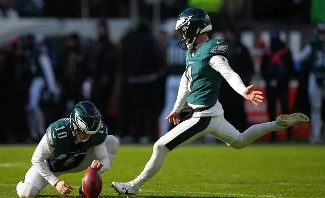 Philadelphia Eagles' Jake Elliott kicks for an extra point during the first half of an NFL football game against the Las Vegas Raiders on Sunday, Dec. 14, 2025, in Philadelphia. (AP Photo/Matt Rourke)