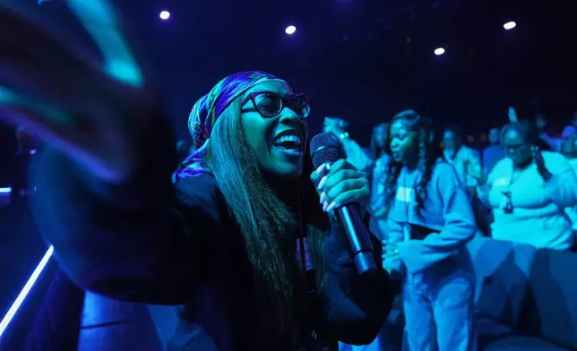 A member of the 2819 prayer team leads churchgoers in prayer before the start of service at 2819 Church on Nov. 16, 2025, in Atlanta. (AP Photo/Jessie Wardarski)