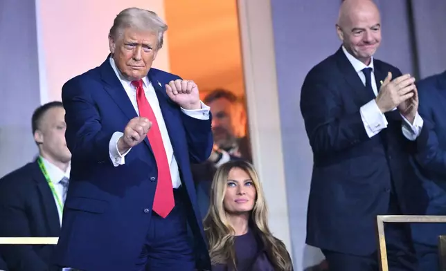 President Donald Trump dances at the end of the draw for the 2026 soccer World Cup at the Kennedy Center in Washington, Friday, Dec. 5, 2025. (Mandel Ngan/Pool Photo via AP)