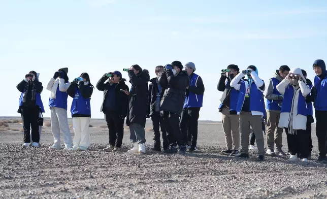 Students wait for the “Nurturing the Future” rocket to launch