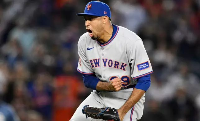 FILE - New York Mets relief pitcher Edwin Diaz (39) reacts at the end of a baseball game against the Washington Nationals, Saturday, April 26, 2025, in Washington. (AP Photo/Nick Wass, File)