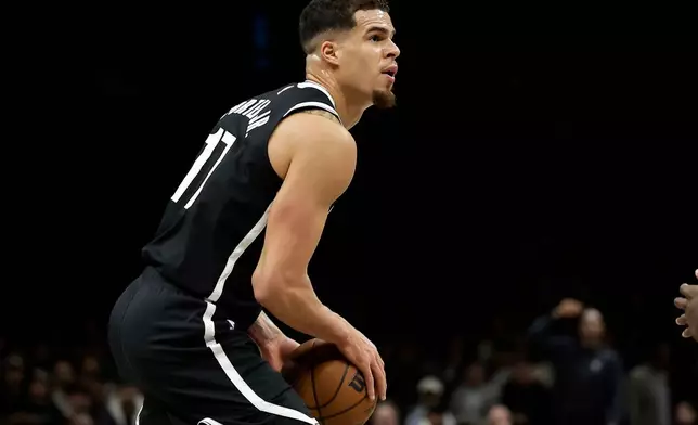 Brooklyn Nets forward Michael Porter Jr. looks to shoot during the first half of an NBA basketball game against the Charlotte Hornets, Monday, Dec. 1, 2025, in New York. (AP Photo/Adam Hunger)