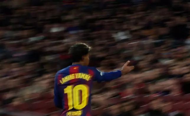 Barcelona's Lamine Yamal, reacts during the Champions League opening phase soccer match between Barcelona and Eintracht Frankfurt in Barcelona, Spain, Tuesday, Dec. 9, 2025. (AP Photo/Joan Monfort)