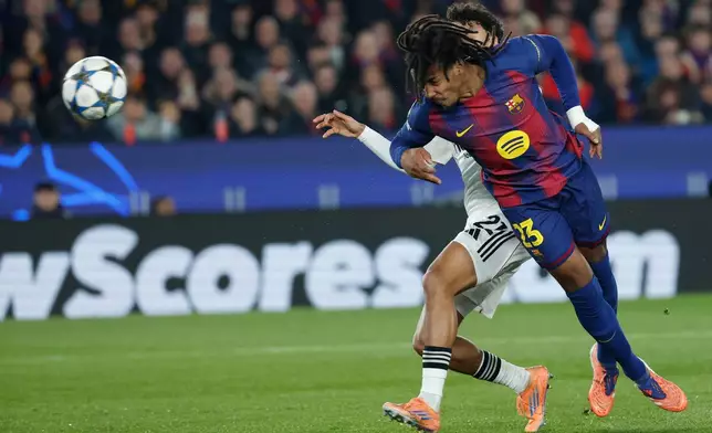 Barcelona's Jules Kounde scores his side's first goal during the Champions League opening phase soccer match between Barcelona and Eintracht Frankfurt in Barcelona, Spain, Tuesday, Dec. 9, 2025. (AP Photo/Joan Monfort)