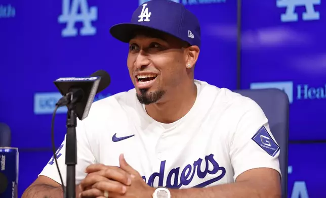 Edwin Díaz speaks during his introduction as a new member of the Los Angeles Dodgers baseball team Friday, Dec. 12, 2025, in Los Angeles. (AP Photo/Ethan Swope)