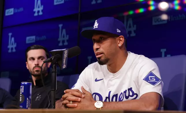 Edwin Díaz speaks during his introduction as a new member of the Los Angeles Dodgers baseball team Friday, Dec. 12, 2025, in Los Angeles. (AP Photo/Ethan Swope)