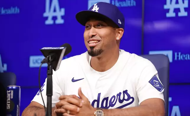 Edwin Díaz speaks during his introduction as a new member of the Los Angeles Dodgers baseball team Friday, Dec. 12, 2025, in Los Angeles. (AP Photo/Ethan Swope)