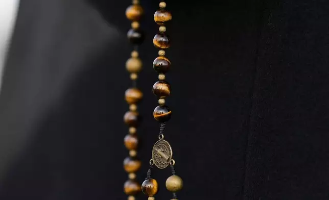 FILE - An anti-death penalty demonstrator holds rosary bead outside Riverbend Maximum Security Institution before the execution of Harold Wayne Nichols, Thursday, Dec. 11, 2025, in Nashville, Tenn. (AP Photo/George Walker IV, File)