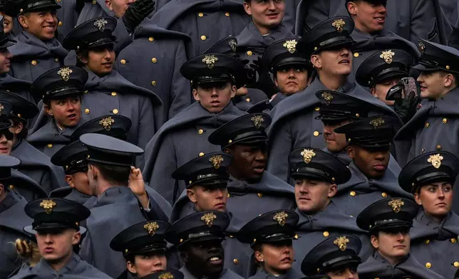 FILE - Army Cadets prepare before the 126th Army-Navy NCAA college football game at M&amp;T Bank Stadium, Saturday, Dec. 13, 2025, in Baltimore. (AP Photo/Julia Demaree Nikhinson, File)