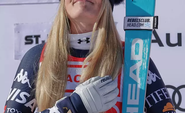 FILE - United States' Lindsey Vonn celebrates winning an alpine ski, women's World Cup downhill, in St. Moritz, Switzerland, Friday Dec. 12, 2025. (AP Photo/Luciano Bisi, File)
