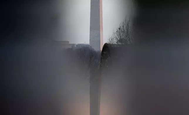 FILE - The Washington Monument is seen shortly after sunrise from Arlington National Cemetery, Saturday, Dec. 13, 2025, in Arlington, Va. (AP Photo/Julia Demaree Nikhinson, File)