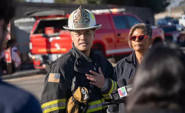 Alameda County Fire Deputy Chief Ryan Nishimoto addresses the media at the site of a gas explosion on the 800 block of East Lewelling Boulevard, Thursday, Dec. 11, 2025, in Hayward, Calif. (AP Photo/Minh Connors)