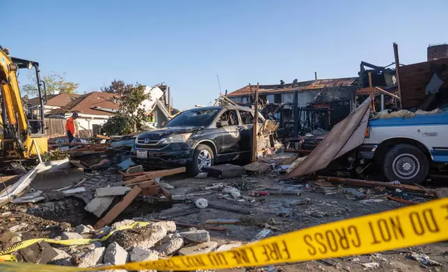 Damage is seen after a gas explosion Thursday, Dec. 11, 2025, in Hayward, Calif. (AP Photo/Minh Connors)