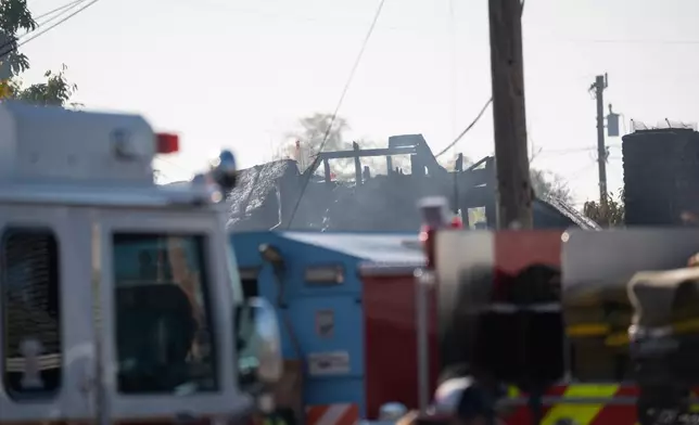 Charred remains of a structure at the site of a gas explosion in a neighborhood, Thursday, Dec. 11, 2025, in Hayward, Calif. (AP Photo/Minh Connors)