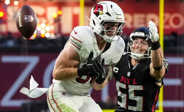 Atlanta Falcons linebacker Kaden Elliss (55) blocks a pass against Arizona Cardinals tight end Trey McBride (85) during the second half of an NFL football game, Sunday, Dec. 21, 2025, in Glendale, Ariz. (AP Photo/Rick Scuteri)