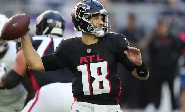 Atlanta Falcons quarterback Kirk Cousins (18) passes against the Arizona Cardinals during the first half of an NFL football game, Sunday, Dec. 21, 2025, in Glendale, Ariz. (AP Photo/Ross D. Franklin)