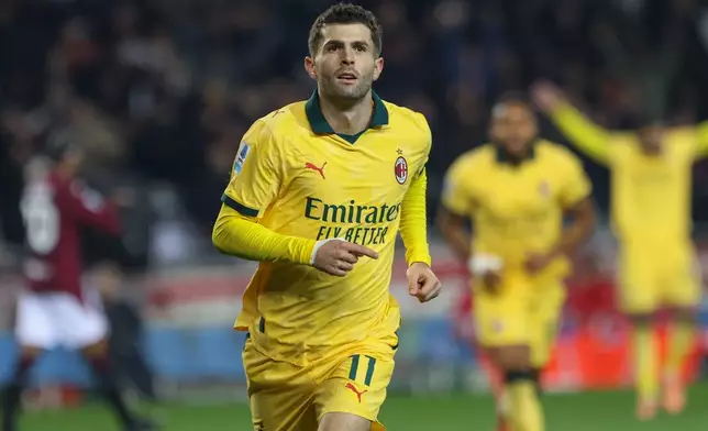 Milan's Christian Pulisic celebrates after scoring a goal during the Serie A soccer match between Torino FC and Milan in Turin, Italy, Monday, Dec. 8, 2025. (Tano Pecoraro/LaPresse via AP)