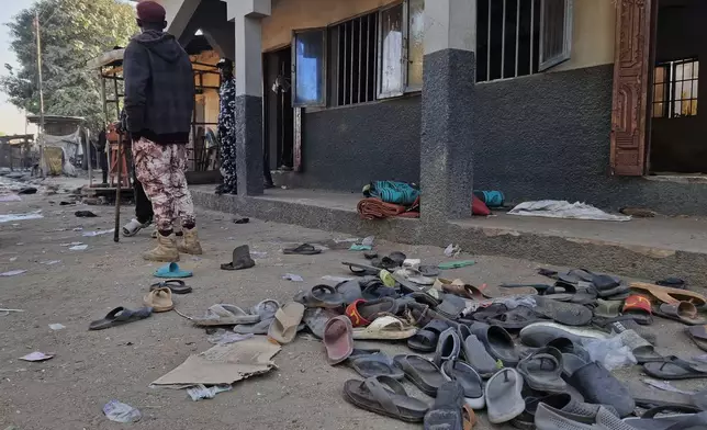Flip-flops belonging to worshippers are seen following a deadly bomb explosion at a mosque in Maiduguri, Nigeria, Thursday, Dec. 25, 2025. (AP Photo/Jossy Ola)