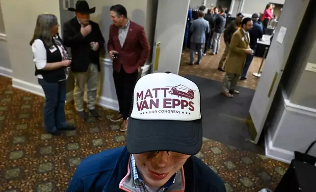 Carson Baddeley and other supporters gather for an election night watch party for Republican candidate Matt Van Epps who is running in a special election for U.S. seventh congressional district seat, Tuesday, Dec. 2, 2025, in Nashville, Tenn. (AP Photo/John Amis)