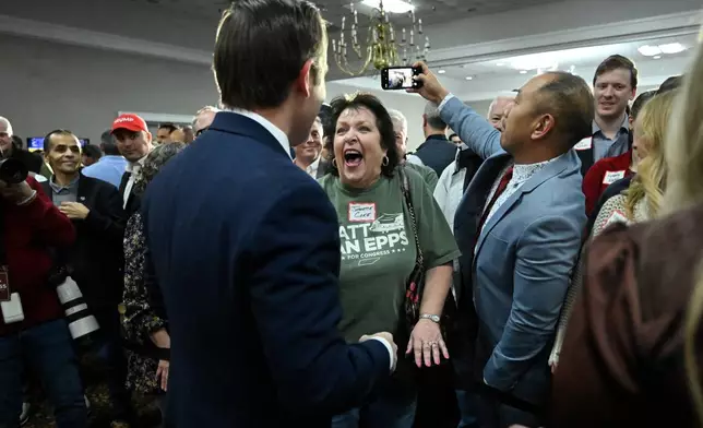 Republican candidate Matt Van Epps interacts with supporters at a watch party after announcing victory in a special election for the U.S. seventh congressional district, Tuesday, Dec. 2, 2025, in Nashville, Tenn. (AP Photo/John Amis)