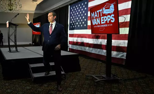 Republican candidate Matt Van Epps waves to supporters at a watch party after announcing victory in a special election for the U.S. seventh congressional district, Tuesday, Dec. 2, 2025, in Nashville, Tenn. (AP Photo/John Amis)