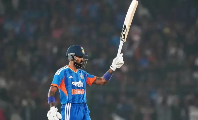 India's Hardik Pandya celebrates his fifty runs during the first T20 International cricket match between India and South Africa in Cuttack, India, Tuesday, Dec. 9, 2025. (AP Photo/Rafiq Maqbool)