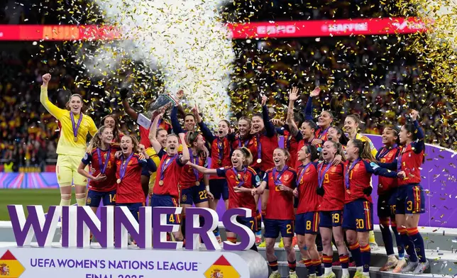 Spain's team captain Irene Paredes lifts the trophy after winning the Women's Nations League final soccer match between Spain and Germany in Madrid, Tuesday, Dec. 2, 2025. (AP Photo/Bernat Armangue)