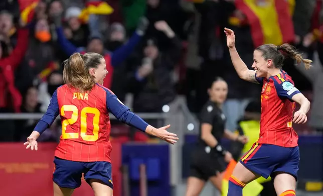 Spain's Claudia Pina (20) celebrates after scoring her side's opening goal during the Women's Nations League final soccer match between Spain and Germany in Madrid, Spain, Tuesday, Dec. 2, 2025. (AP Photo/Bernat Armangue)