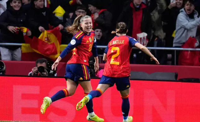 Spain's Claudia Pina, left, celebrates after scoring the opening goal during the Women's Nations League final soccer match between Spain and Germany in Madrid, Tuesday, Dec. 2, 2025. (AP Photo/Manu Fernandez)