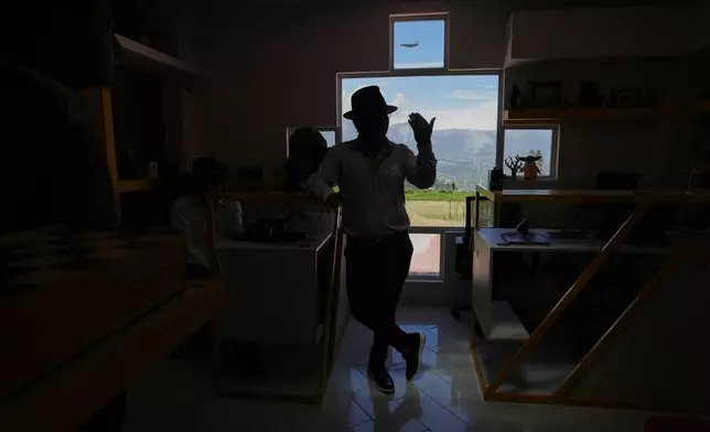 Tupac Amaru, the director of "Aya Somos," the first Quichua animated short, blending Otavalo culture with Japanese-style anime, gives an interview in Hatun Rumi, Ecuador, Wednesday, Dec. 3, 2025. (AP Photo/Dolores Ochoa)