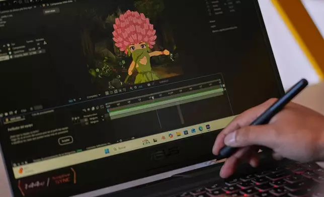Yarik Sisa, an artist with Yay Animación, works on "Aya Somos," the first Quichua animated short, blending Otavalo culture with Japanese-style anime, in Hatun Rumi, Ecuador, Wednesday, Dec. 3, 2025. (AP Photo/Dolores Ochoa)