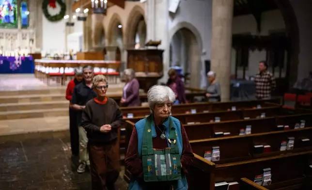 Betty Cole leads an interfaith meditation practice at All Saints Episcopal Church in Pasadena, Calif., on Monday, Dec. 15, 2025. (AP Photo/William Liang)