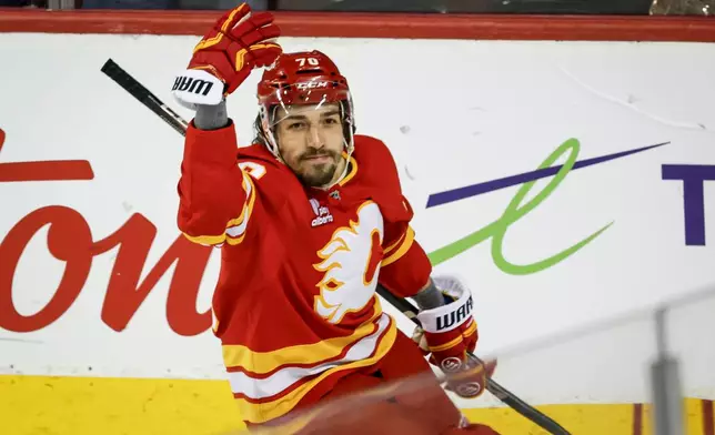 Calgary Flames' Ryan Lomberg celebrates his goal during the second period of an NHL hockey game in Calgary, Alberta, Saturday, Dec. 27, 2025. (Jeff McIntosh/The Canadian Press via AP)